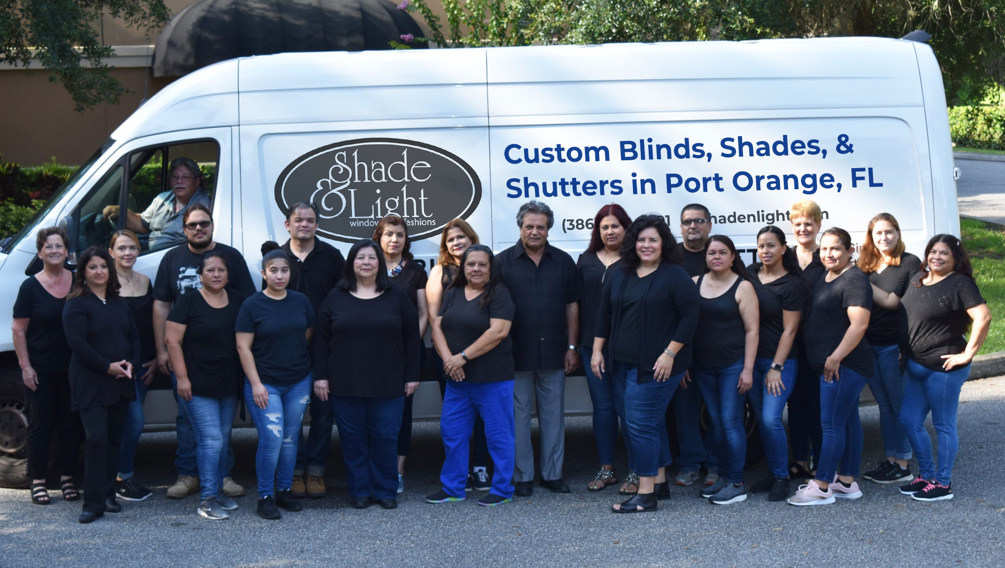 Our proud Shade & Light team unified together in front of work van